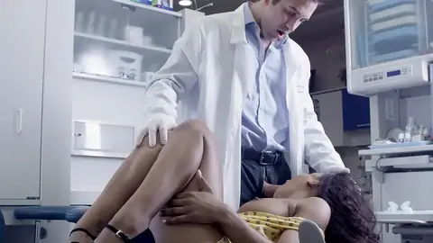 Doctor pokes face of surprised patient in the hospital