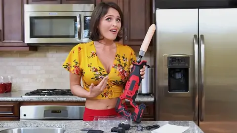 Prepping to drill the dark-haired honey with a machine